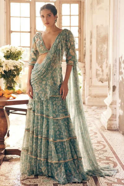 An ice blue vintage floral printed chiffon pre–draped saree