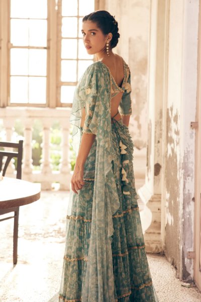 An ice blue vintage floral printed chiffon pre–draped saree